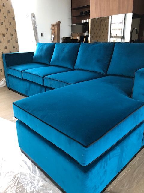 Re-upholstered sofa with blue velvet covers